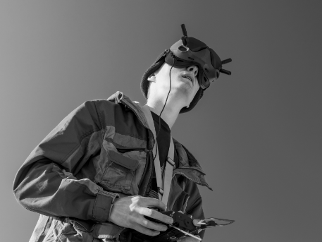 A young girl piloting a robot